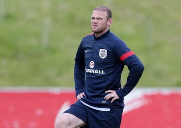 Wayne Rooney trains with the  England squad at St Georges Park yesterday. Picture: PA