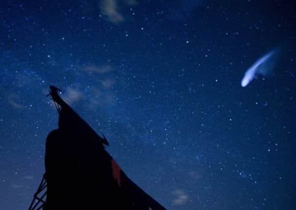 In this long exposure photo, a streak appears in the sky during the annual Perseid meteor shower in Villarejo de Salvanes, Central Spain. Picture: AP