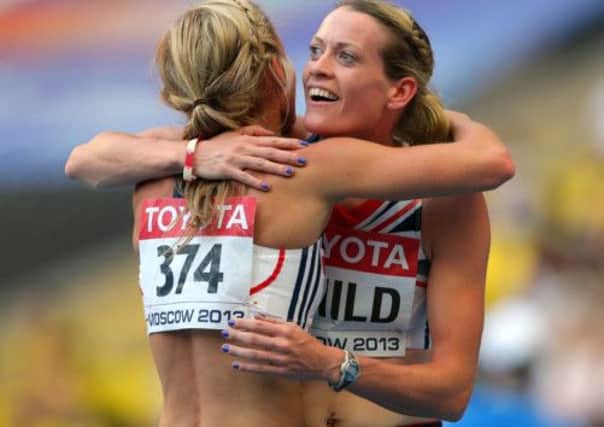 Eilidh Child, right, hugs team mate Meg Beesley after the women's 400m hurdles semi-final. Picture: PA