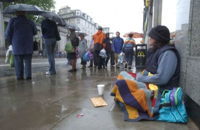 Aberdeen Council look set to press ahead with plans to outlaw begging on the Granite City's streets. Picture (posed by model): Phil Wilkinson