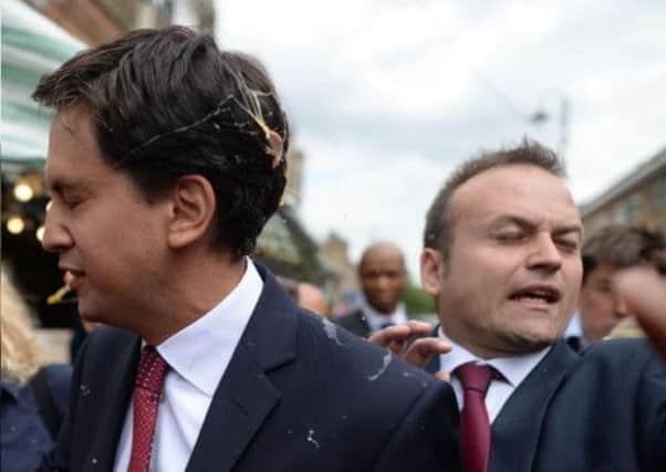 Ed Miliband reacts after being struck by an egg. Picture: Complimentary