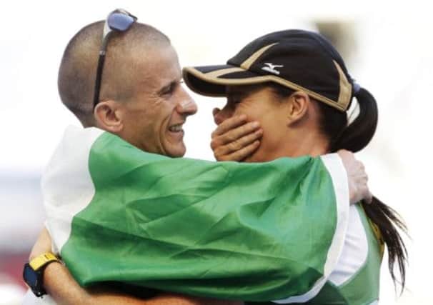 Irelands Robert Heffernan, left, embraces wife Marian after winning the mens 50km race walk. Picture: AP