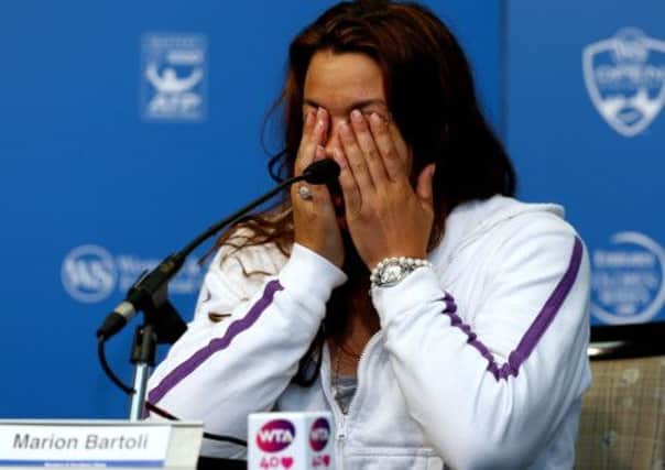 Marion Bartoli of France announces her retirement from professional tennis. Picture: Getty