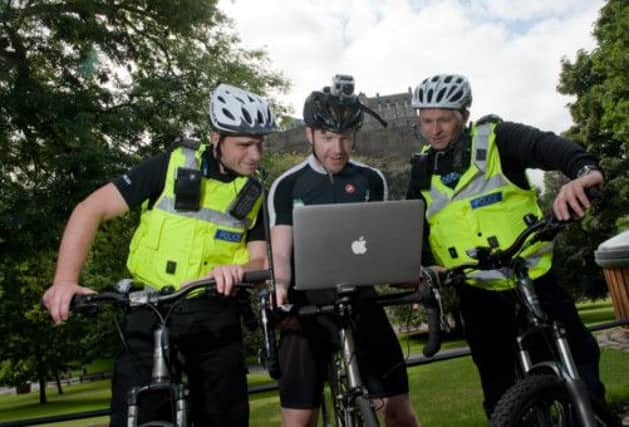 PICTURE BY GARETH EASTON PHOTOGRAPHY 07752 666 522 - FREE TO USE
SECURITY EXPERT JAMES LYNE (CENTRE) WITH POLICE OFFICERS PC RICHARD HOOPER (L) AND PC NEIL WILSON SCANNING FOR UNSECURE WIFI NETWORKS IN THE CAPITAL.

James Lyne, with PCs Richard Hooper (left) and Neil Wilson, scanning for unsecure wifi networks in Edinburgh. Picture: Gareth Easton