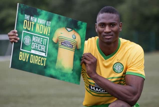 Celtic's new striker Amido Balde shows off the new away kit, and told reporters he felt like a son of Celtic. Picture: SNS
