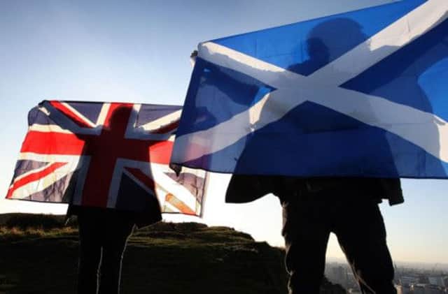 In September next year Scotland will vote in the referendum to decide among many other things, the flag that will fly above our institutions. Picture: PA