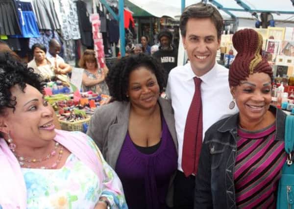 All smiles: But Ed Miliband is the least popular leader of the three main parties, according to a new poll. Picture: PA