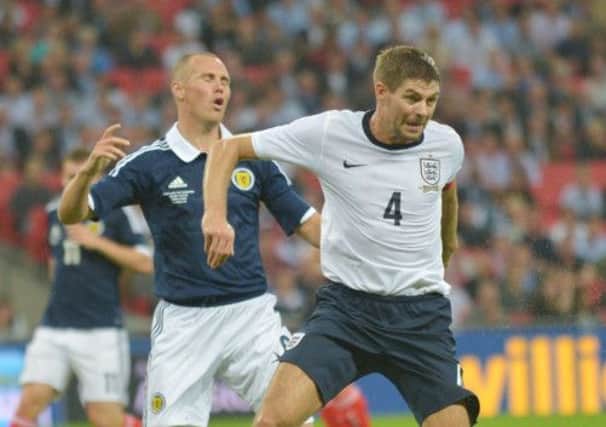 Steven Gerrard and Kenny Miller in action. Picture: Phil Wilkinson