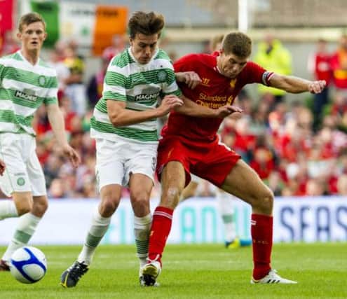 Jackson Irvine, left, pitted his wits against Steven Gerrard in Celtic's win over Liverpool before sealing his loan move.  Picture: SNS