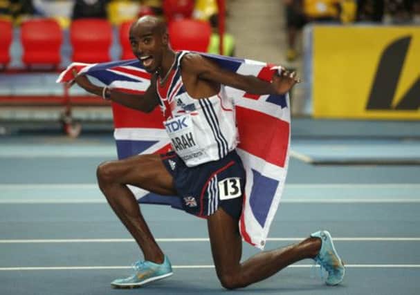 Mo Farah celebrates after winning 5,000m gold at the World Championships in Moscow last night. Picture: AP