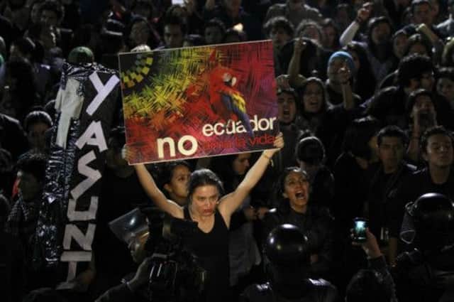 Green campaigners gather outside the presidential palace in Quito yesterday. Picture: AP