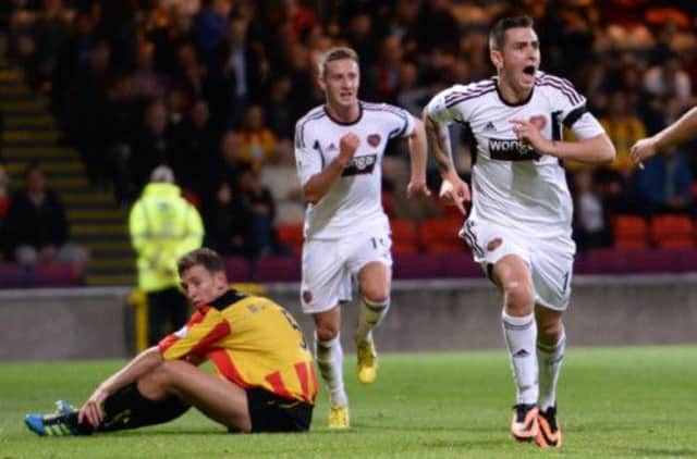 Jamie Walker celebrates his late equaliser for Hearts. Picture: SNS