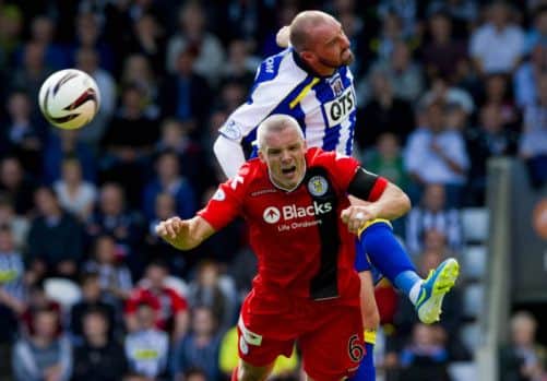 St Mirren's Jim Goodwin goes up against Kris Boyd. Picture: SNS
