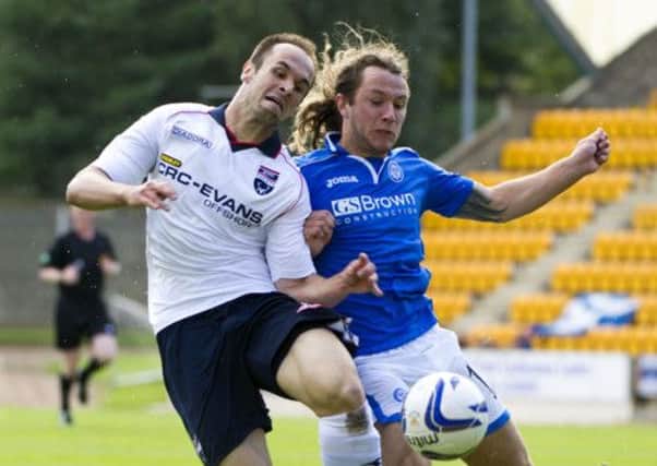 Stevie May (right) battles with Ross County's Branislav Micic. Picture: SNS