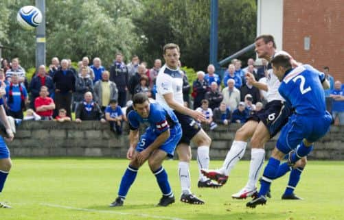 Rangers captain Lee McCulloch scores his side's third goal. Picture: SNS