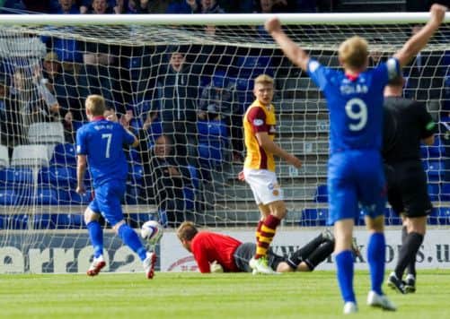Billy McKay (left) races off to celebrate after scoring ICT's second goal of the game. Picture: SNS