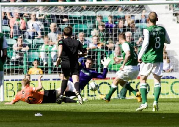 Stuart Armstrong (2nd from left) slots the ball home to give Dundee Utd the lead. Picture: SNS