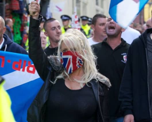 About 130 members of the Scottish Defence League and English Defence League marched down the Royal Mile to the Scottish Parliament at Holyrood yesterday. Picture: Joey Kelly