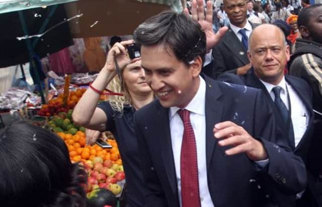 Labour leader Ed Miliband after he was pelted with eggs during a campaign visit in East Street market in Walworth. Picture: PA
