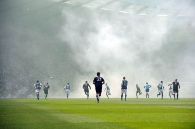 Flare smoke drifts across Hampden during last season's Scottish Cup final between Celtic and Hibs. Picture: Jane Barlow
