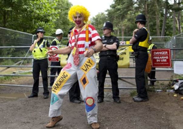 A protester dressed as a clown outside the Cuidrilla site in Balcombe, England. Picture: Getty Images