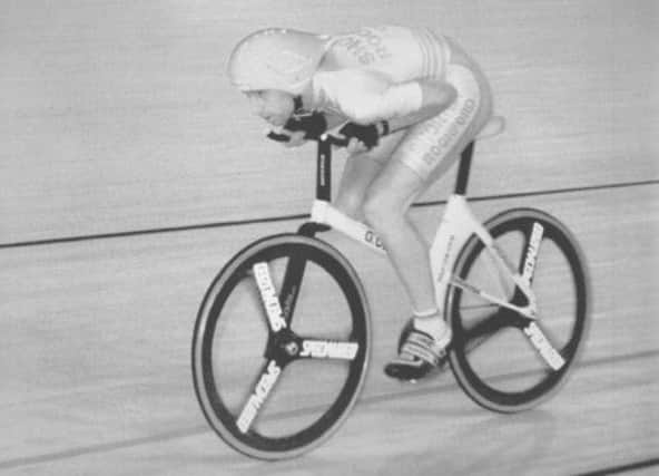 Graham Obree powered to a world record on his home-made bicycle as he won the 4,000m world pursuit title in 1994