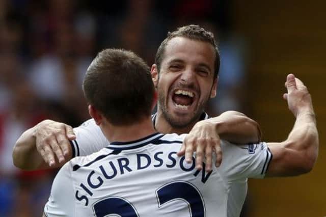 Tottenhams Roberto Soldado celebrates with team-mate Gylfi Sigurdsson after scoring his sides match-winning penalty. Picture: Reuters