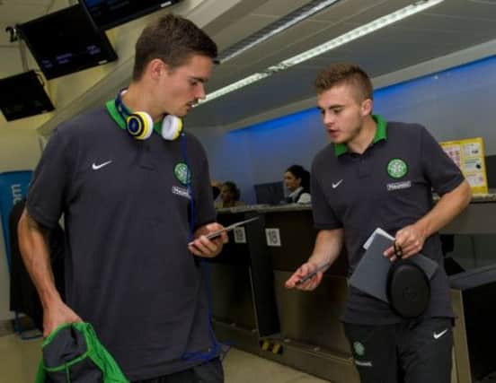 Mikael Lustig (left) and James Forrest check in en route to Kazakhstan. Picture: SNS
