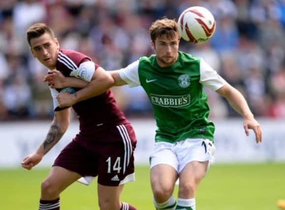 Lewis Stevenson, right, was relieved to get first point for Hibs. Picture: SNS