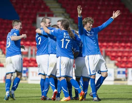 Dave Mackay (2nd left) is mobbed after scoring St Johnstone's fourth of the match. Picture: SNS