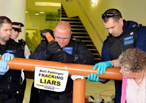 Protesters glued themselves to the front door of PR firm Bell Pottinger. Picture: PA