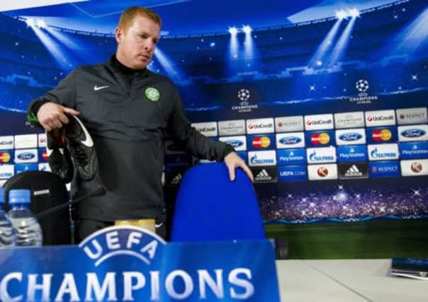 Neil Lennon takes his seat last night for a press conference in Astana. Picture: SNS