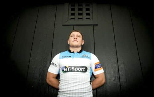 Duncan Weir, the Glasgow Warriors fly half, models his side's new changed strip. Picture: SNS
