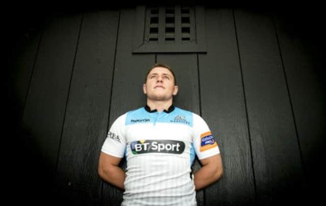 Duncan Weir, the Glasgow Warriors fly half, models his side's new changed strip. Picture: SNS