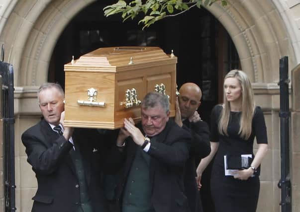 The coffin of former Scottish Tory leader David McLetchie is carried from St Columba's Church. Picture: PA