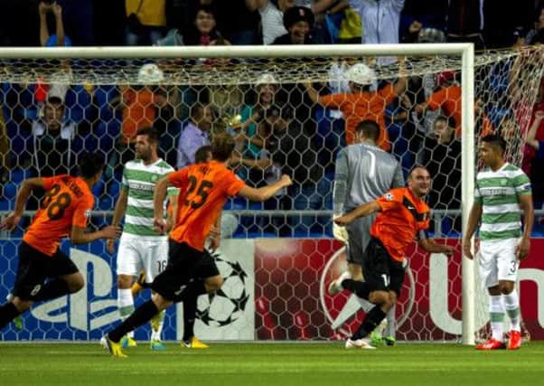 Andrei Finonchenko (2nd right) celebrates after firing Shakter Karagandy ahead. Picture: SNS