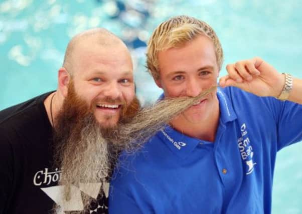 Robbie Renwick has a laugh with the beard of comic Adam Page. Picture: Phil Wilkinson