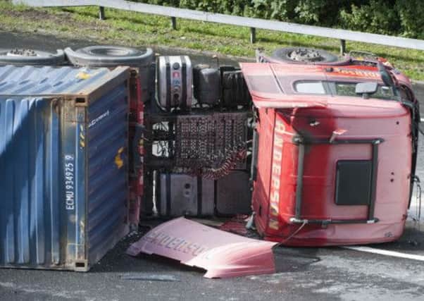 An overturned articulated lorry caused traffic delays on the M8 on Wednesday. Picture: Agency