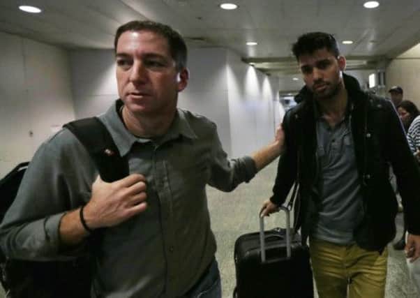 Guardian journalist Glenn Greenwald with his partner David Miranda at Rio Airport. Picture: Reuters