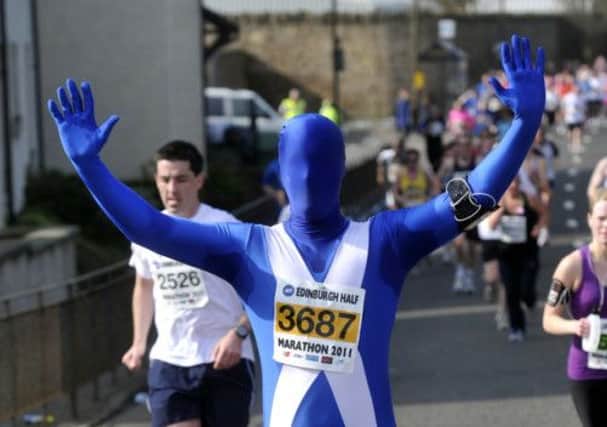 A man in a Morphsuit runs the Edinburgh Half Marathon. Picture: Dan Phillips