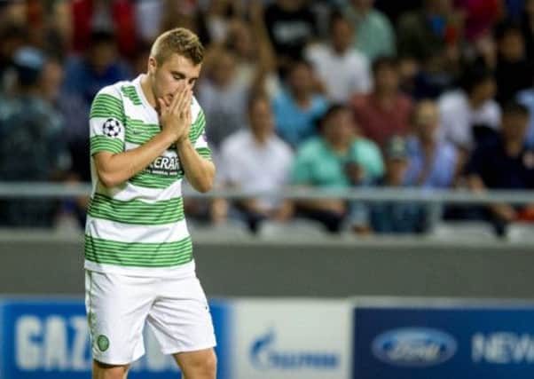 James Forrest hangs his head after missing a chance in Tuesday's loss. Picture: SNS