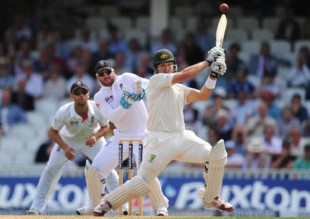Australia's Shane Watson hits the ball for four during day one. Picture: PA