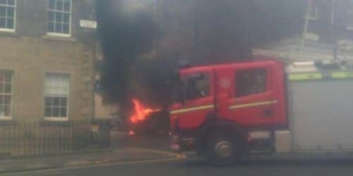 The car on fire in Edinburgh city centre. Picture: Kenny Farquharson