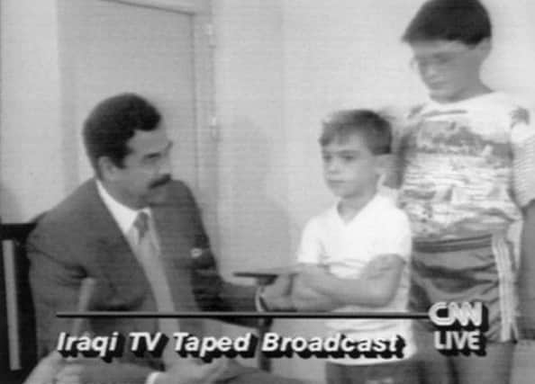 On this day in 1990 Iraqi dictator Saddam Hussein appeared on state television with a group of hostages, including children. Picture: Reuters