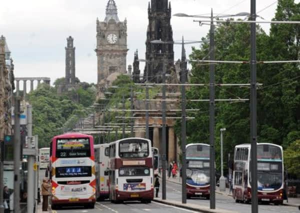Buses operated by Lothian Buses seen on Princes Street, where the trams will run from next year. Picture: Jane Barlow