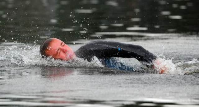Olympian and Commonwealth Gold medallist Robbie Renwick swims in Loch Lomond. Picture: Robert Perry