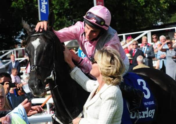 William Buick is congratulated by owner Lady Lord Webber after winning the Darley Yorkshire Oaks. Picture: PA