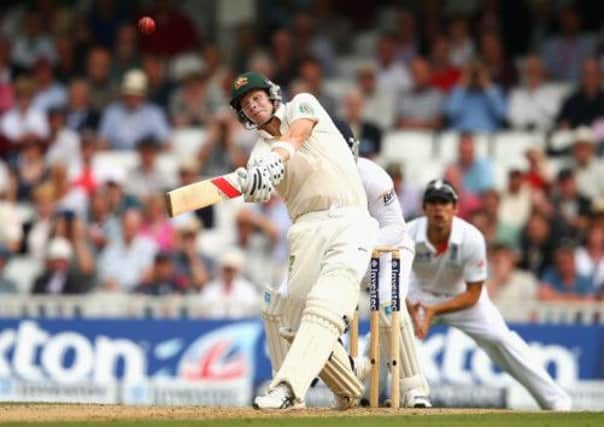 Australias Steve Smith hits a six to bring up his maiden Test century on day two at the Oval. Picture: Getty