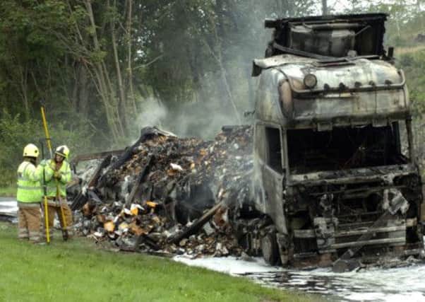 A lorry was completely destroyed after its cargo, a load of chicken pieces, caught fire. Picture: Jim McEwen