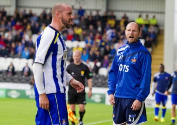 Red carded: Kris Boyd heads off as Allan Johnston looks on. Picture: SNS